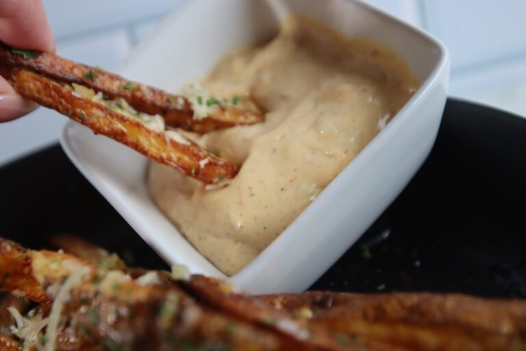 Fries dipped in mac sauce